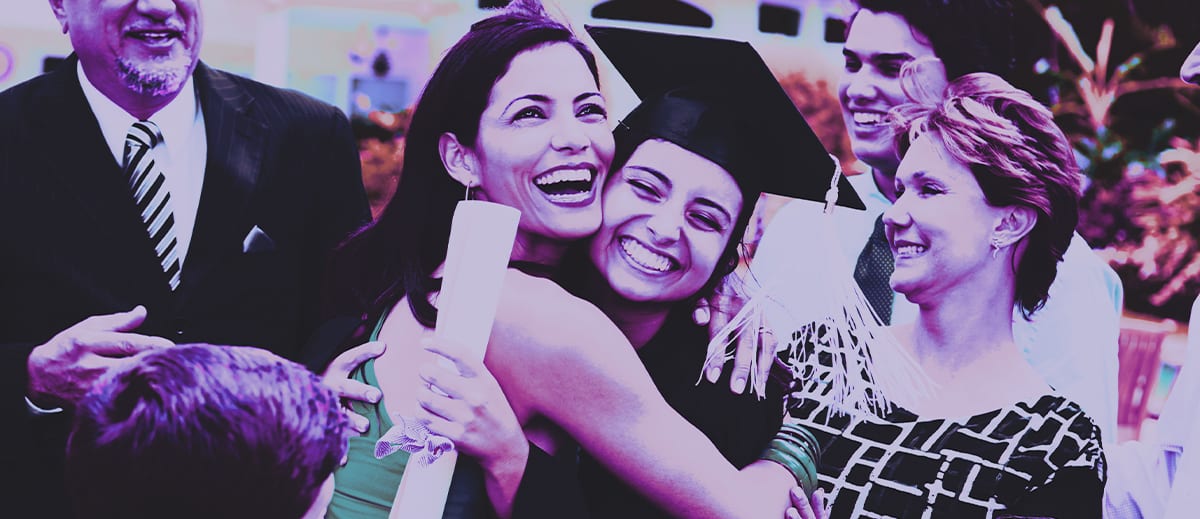 Mother and daughter hugging at high school graduation